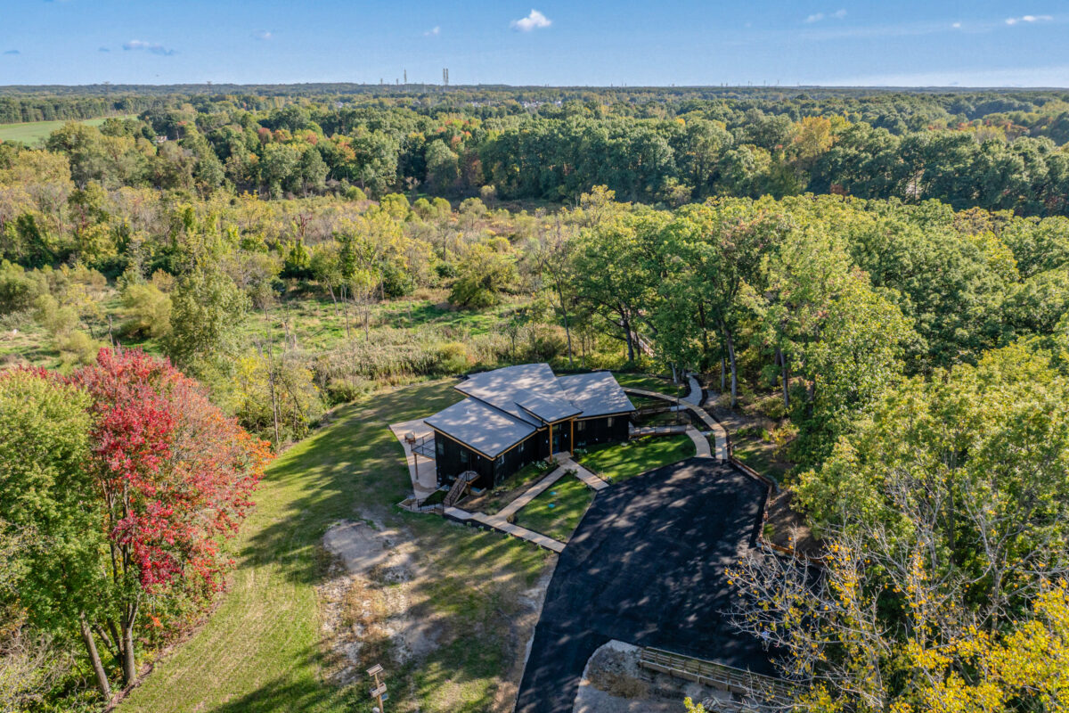 An drone photograph of a modern home set on the Valparaiso Moraine