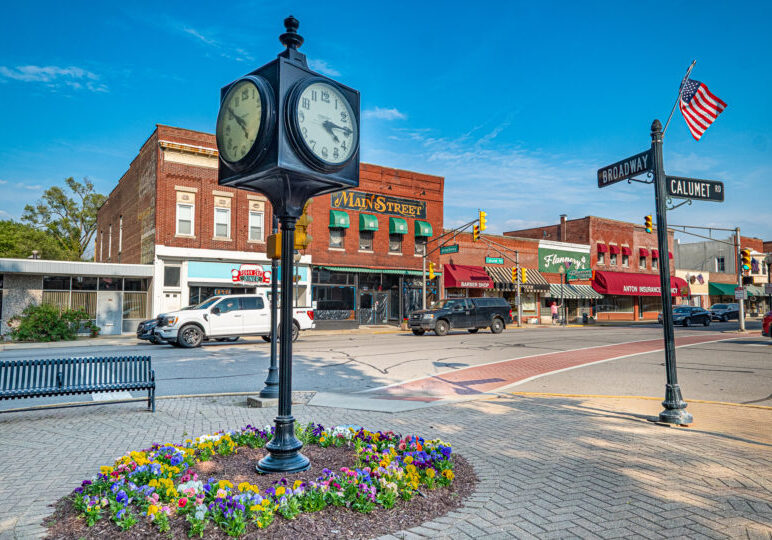 chesterton-downtown-1920 Downtown Chesterton, Indiana, with a large black street clock in Thomas Centennial Park at the corner of Broadway and Calumet Road.