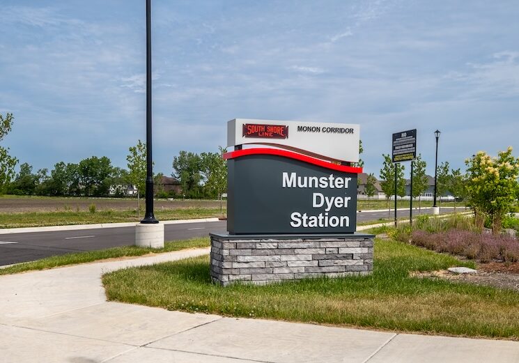 Modern sign at transport station that reads "Munster Dyer Station"